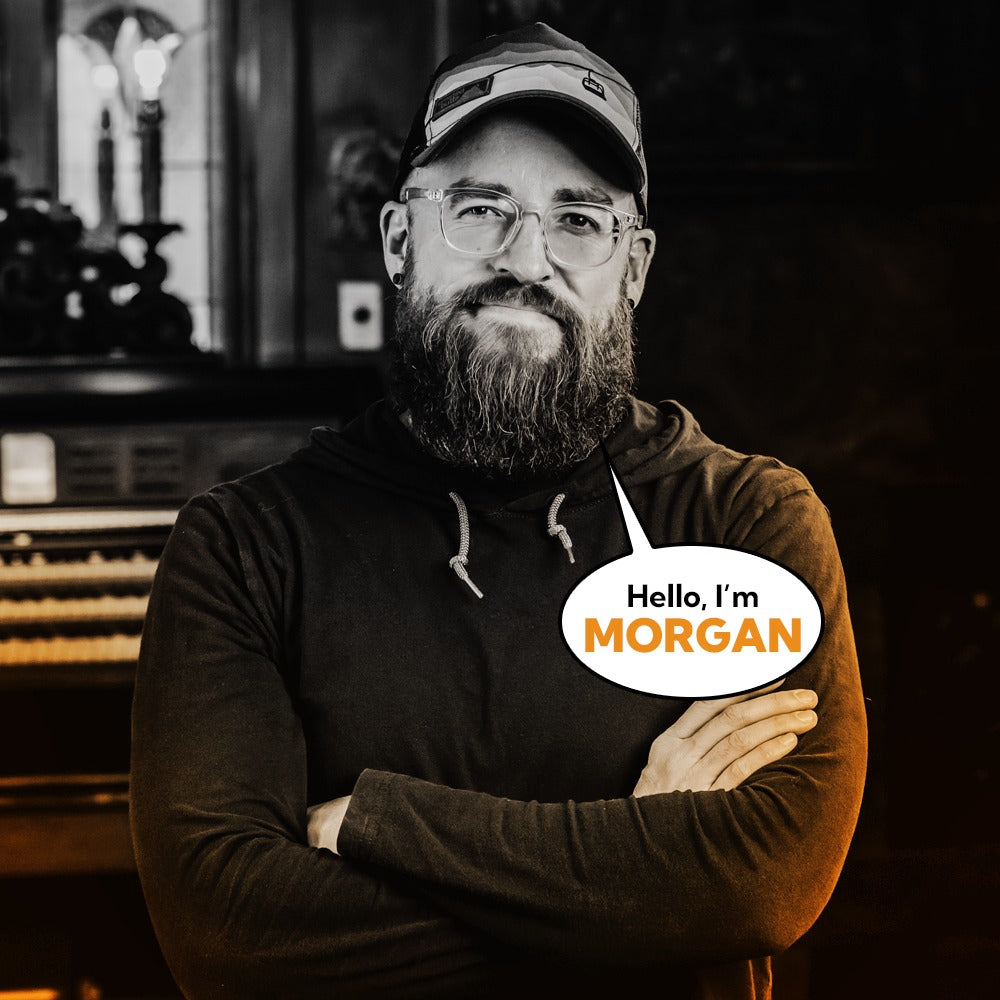 Morgan Henson, Communications Director at Corvus Comics, smiling warmly in professional portrait.