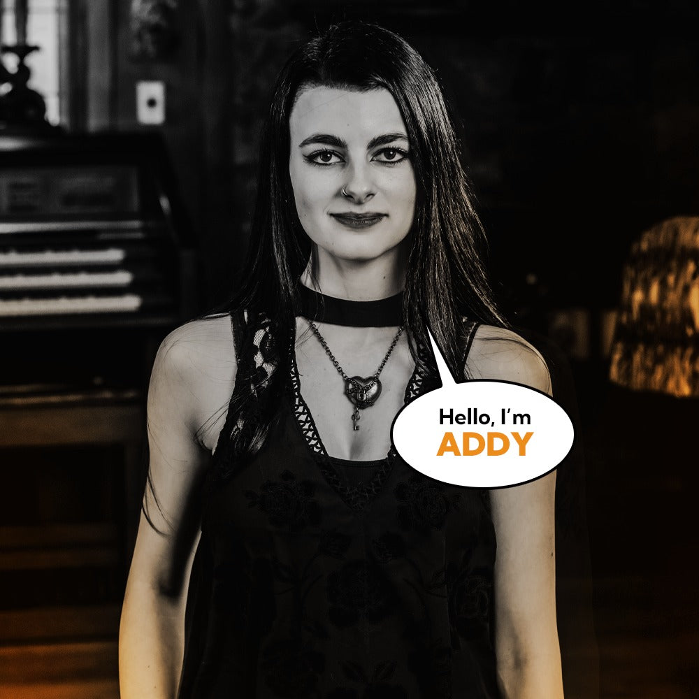 Addy Wood, Communications Manager at Corvus Comics, smiling in professional portrait.